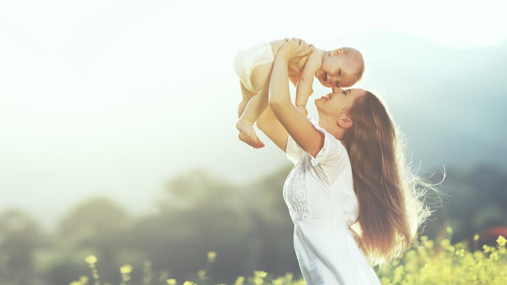 A Lady is Playing with Little Kid